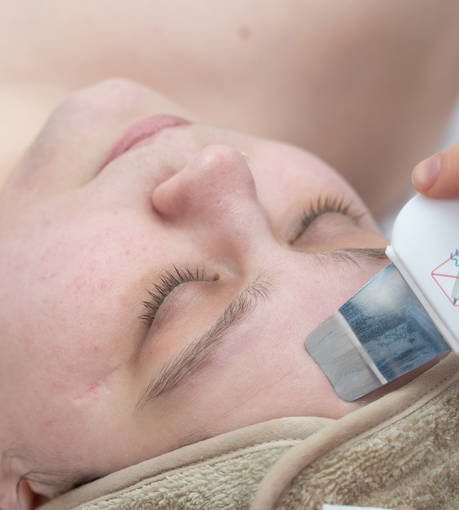 a close up of a person holding a tattoo
